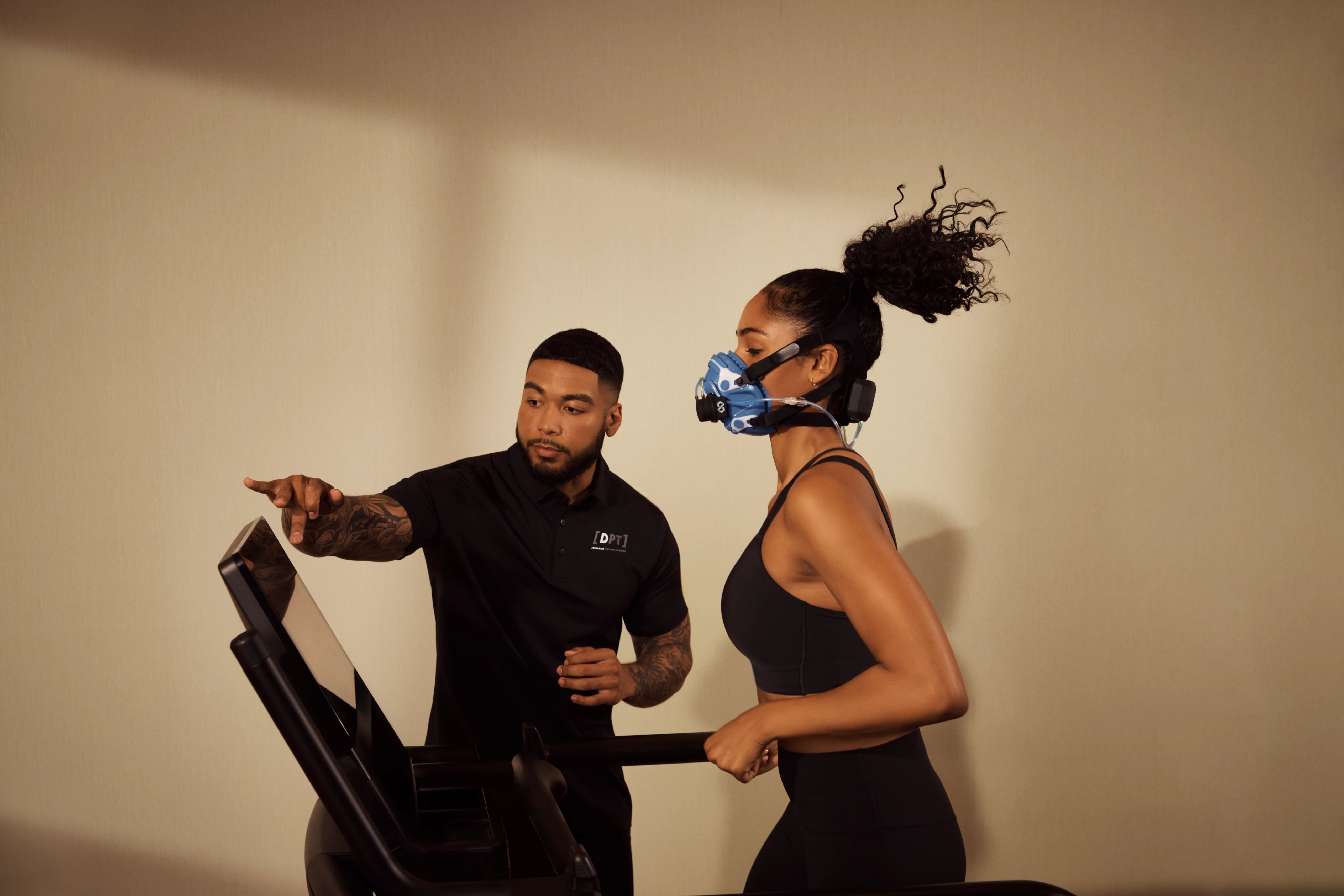 Client undergoing a metabolic assessment on a treadmill